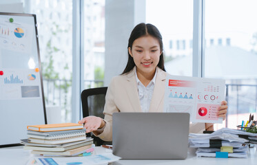 Asian Businesswoman Presenting Data Charts Online