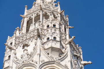 Gothic church tower richly decorated with gargoyles and carvings in Budapest
