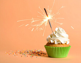 Birthday cupcake with sparkler on orange background