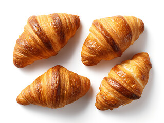Four fresh croissants on a white background with golden crust