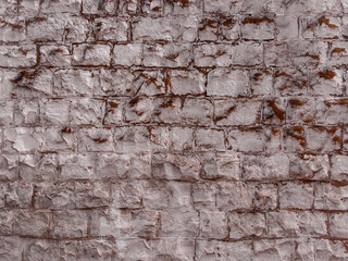 a distressed, aged brick wall with white paint or plaster illustration. space for copy