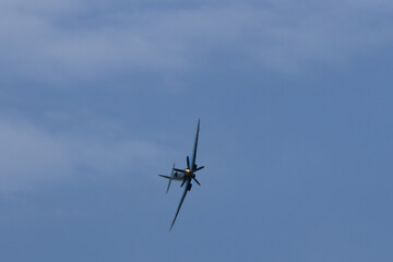 Spitfire plane in flight on sunny day. High quality photo