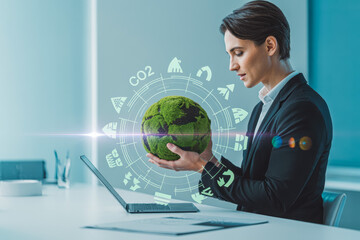 A professional examines a moss-covered globe with eco-themed icons, representing sustainability and CO2 reduction. The setting is a modern office, emphasizing green technology solutions.