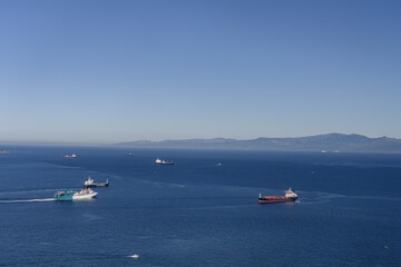 Cargo and passenger ships navigating the Strait of Gibraltar