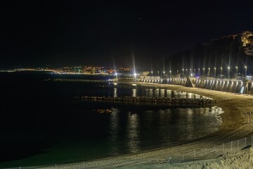 Coastal night view of Ceuta illuminated by streetlights