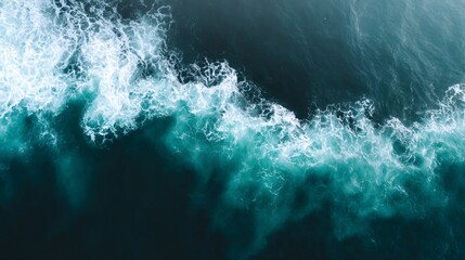 Fototapeta premium Turquoise ocean waves crashing with white foam, aerial view