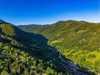 Mountain valley under a blue sky in summer