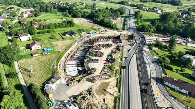 Poland. New junction with tunnel under construction on Zakopianka highway in Krzyszkowice village. State in June 2025. Aerial drone view