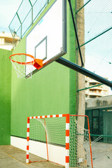 basketball hoop on the court with a soccer goalpost