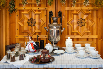 Traditional Tea Samovar and Teacup Setup with Wooden Backdrop