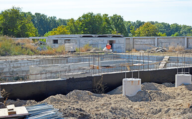 construction of the foundation of a new residential building. the basement and ground floor are...