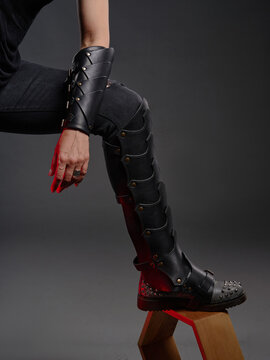 Closeup of Steampunk-Inspired Leather Arm and Leg Armor with Studded Boots