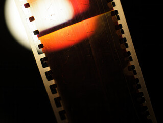 Vintage 35mm film strip texture with scratches and dust.