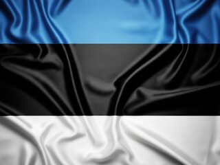 Top-down view of a badly creased silk flag of Estonia