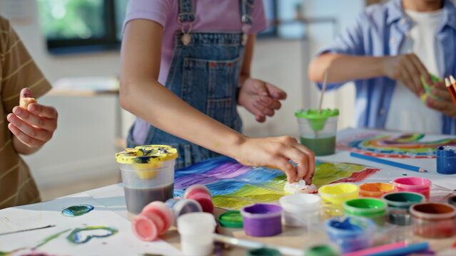 Children creating colorful crafts at art workshop closeup. Pupils artclass 