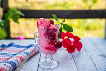 Cherry and raspberry ice cream, summer dessert with cherry on top..