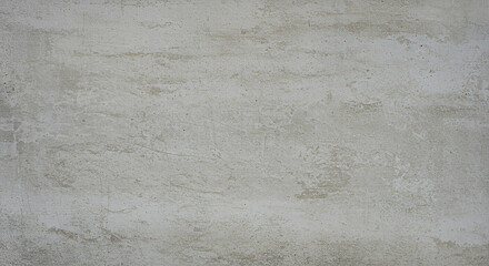 Obraz premium A close up view of a gray concrete wall showing its texture and subtle color variations throughout it
