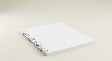 A close up shot of a white spiral notebook on a white surface in a well lit environment studio shot