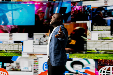 Young black person connecting to global social networks apps through mobile devices, opening...