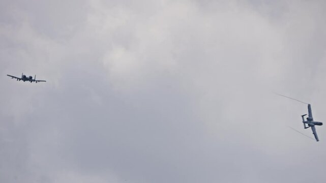 Two A-10 Thunderbolt II Planes Flying in Formation before Splitting Mid-Flight Through Cloudy Sky