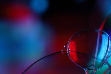 Red reflections of liquid in macro, red liquid surface, bubbles in macro, connection of bubbles in...