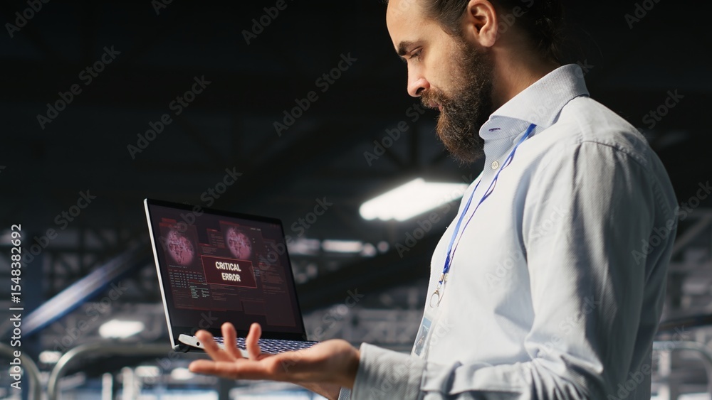 Poster annoyed engineer in data center reacting to critical error message on laptop. irked it professional 