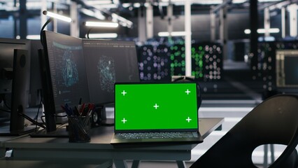 Chroma key laptop and desktop PC used for visualizing AI workloads and inspecting server room...