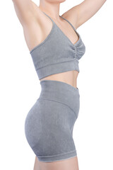 Close-up shot of a woman's lower torso and buttocks wearing grey ribbed knit sports shorts and a...