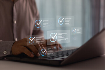 Businessman typing on laptop. Business evaluation and performance tracking in cyberspace using...