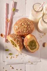 Homemade and sweet pistachio donuts as takeaway dessert.