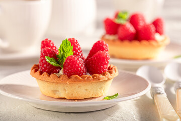 Tasty and homemade mini tart as summer cake with coffee.