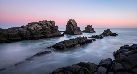 Serene Coastal Landscape with Rugged Rock Formations and Smooth Water at Dawn or Dusk