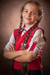 Child girl school girl elementary school student in uniform portrait. Back to school concept.