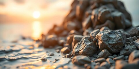 Rugged Coastal Rocks at Dawn, Bathed in Soft Orange Light with a Misty Ethereal Ocean Background.