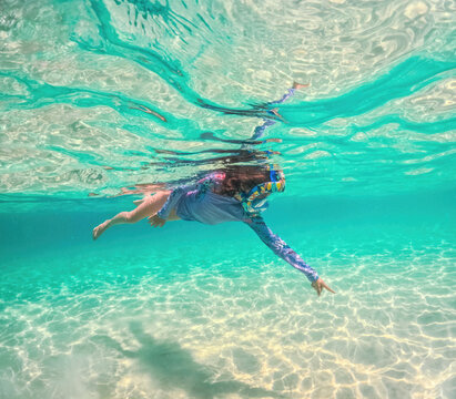 Child Snorkeling Underwater in Crystal Clear Tropical Sea Ocean Water Greece summer vacation