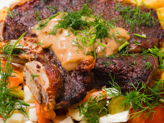 Dinner with premium t bone steak, fried potatoes chips with ridge, fresh salad with feta cheese on...