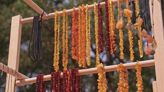 Valuable Jewellery Natural Amber Necklaces Sold on Outdoor Market Stand at Baltic Seaside Resort in Poland
