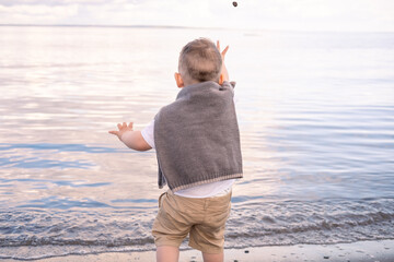 little boy playing on the beach