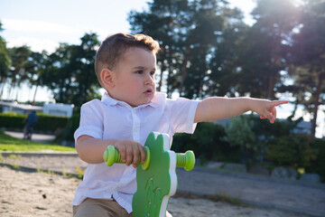 little boy playing on the playground