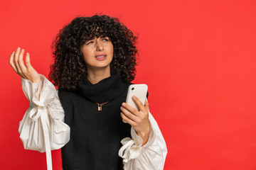 Upset sad Caucasian woman use smartphone typing browsing, play game, loses, surprised by sudden...