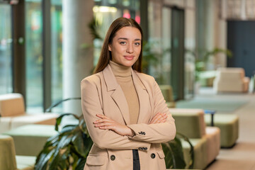 Confident smiling female chief boss in formal clothing looking at the camera. Pretty woman leader...