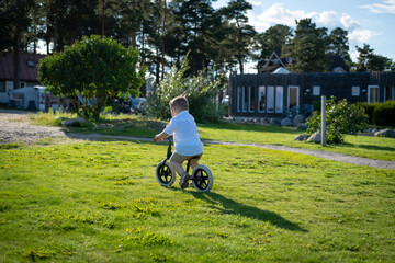 young boy riding a bike