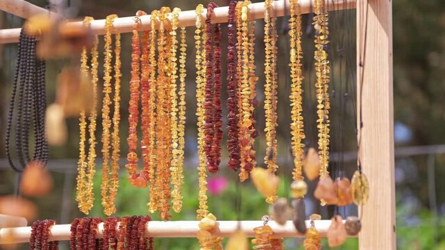 Valuable Jewellery Natural Amber Necklaces Sold on Outdoor Market Stand at Baltic Seaside Resort in Poland