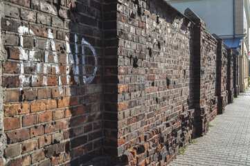 brick fence old building ruin, damaged brick wall