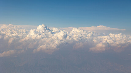 Serene Skies An Aerial View That Showcases the Stunning Beauty of Soft, Fluffy Clouds Above