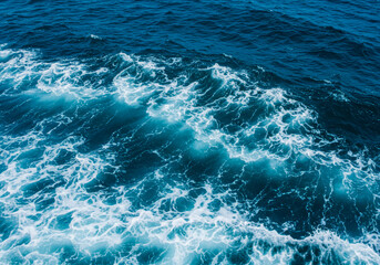 Fototapeta premium Abstract blue sea water with white foam for background