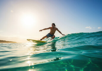 Surfer on a yellow surfboard in the ocean on a sunny day
