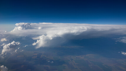 Experience the Captivating Aerial View of Beautiful Clouds and the Clear Blue Sky Above You