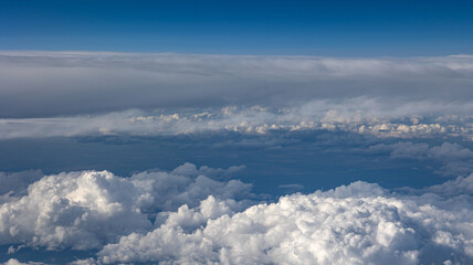 Experience the Captivating Aerial View of Beautiful Clouds and the Clear Blue Sky Above You