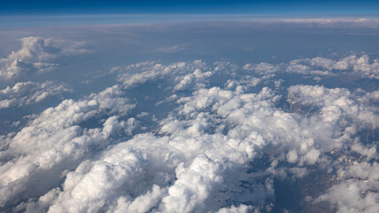 A Breathtaking Scenic Aerial View of Billowing Clouds Floating Above a Beautiful Landscape